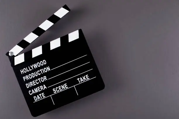 Movie clapper board on dark background with copy space.