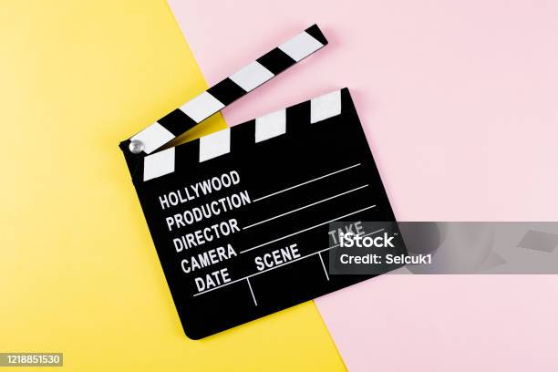 Movie Clapper Board On Yellow And Pink Background With Copy Space Stock Photo - Download Image Now