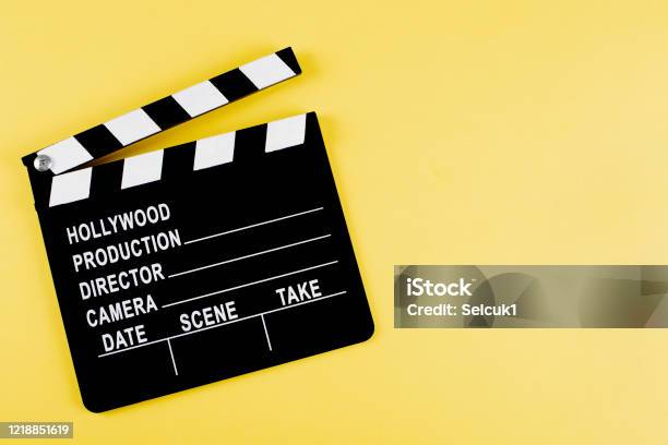 Movie Clapper Board On Yellow Background With Copy Space Stock Photo - Download Image Now