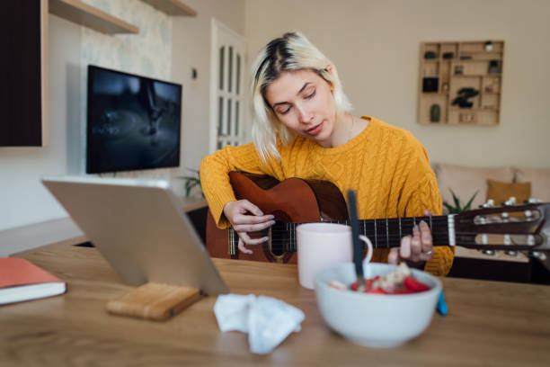 istock Young musician podcasting about guitar playing 1218856709