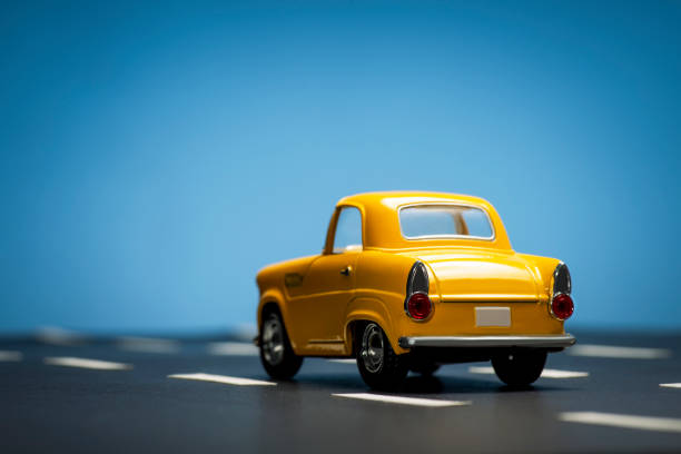 istock Yellow toy car on a blue background. 1218857649