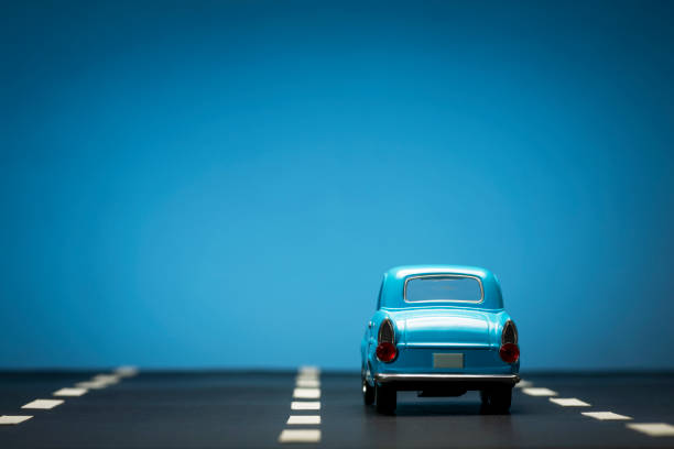 istock Blue toy car on a blue background. 1218857662