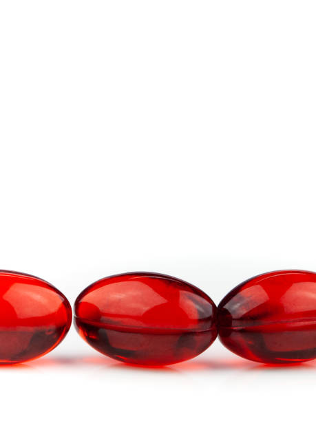 istock Red gel medical capsules isolated on a white background 1218857996