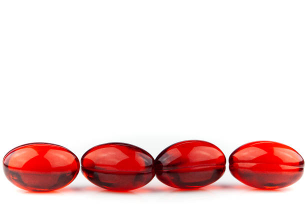 istock Red gel medical capsules isolated on a white background 1218858003