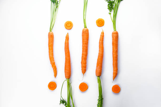istock Flat lay composition with ripe fresh carrots on white background 1218858150