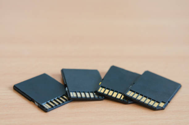 istock Close-up of multiple  old  sdhc  memory cards and adapters . 1218859737
