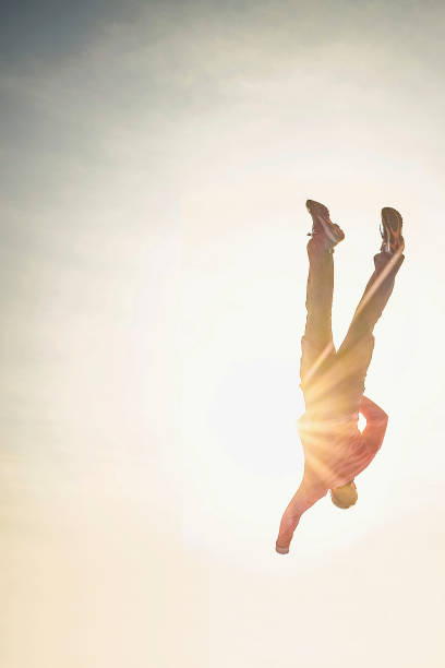 istock Body of an young man falling from the sky down 1218860614