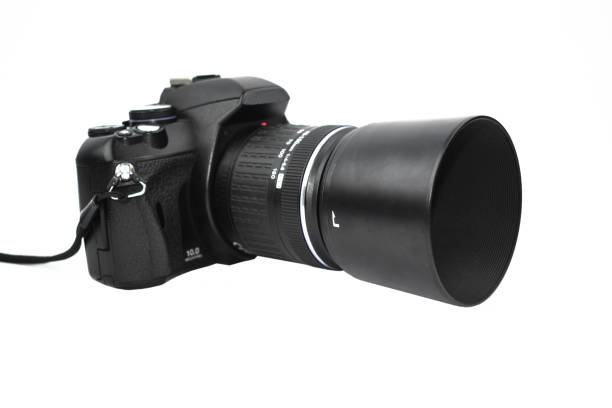 istock Front view of one black colored camera with lens attached to it placed on an isolated white background 1218861690