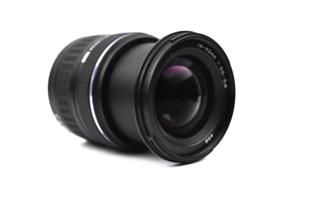 istock Front view of a single camera lens of black color placed on an isolated empty white background 1218861691