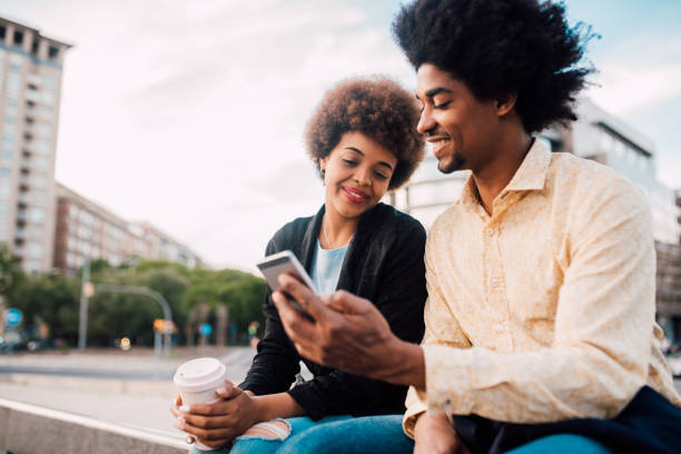 istock Young couple taking a city break and using smartphone 1218865360