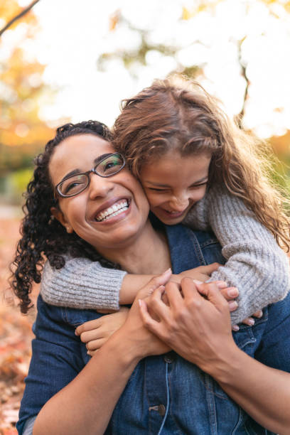 istock Happy mom and daughter playing together outside 1218865372