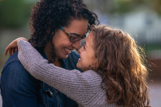 istock Mother and daughter embracing 1218865373