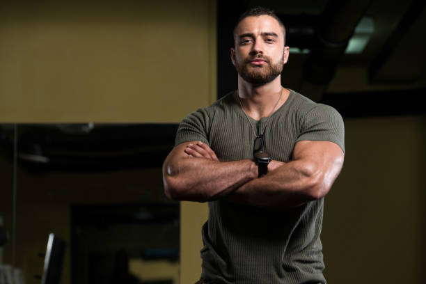 Portrait Of A Muscular Man In Green Shirt stock photo