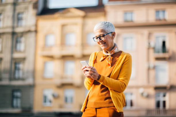 istock Older woman standing outside 1218865568