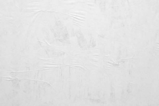 istock Blank white crumpled and creased paper poster texture background 1218865637