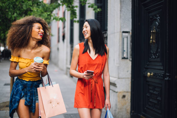 istock Two girls on a journey shopping and having fun 1218865717