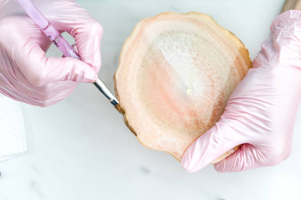 istock Creativity and craft. A young girl creates coasters from resin. Gift wrapping. Decorative packaging. Idea for business. Remote work, work at home. Art coasters. 1218865787