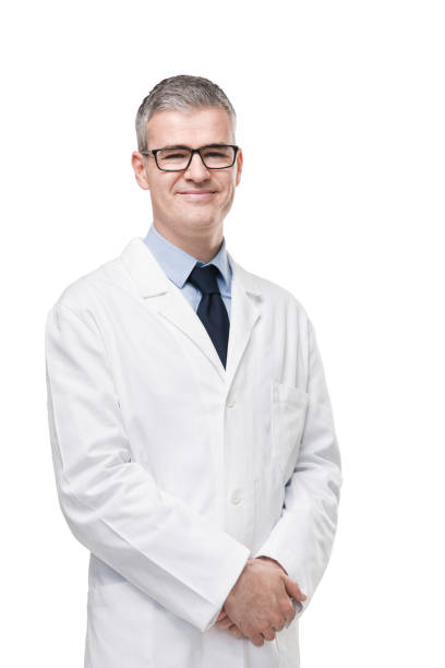 Confident male doctor or pharmacist in white lab stock photo