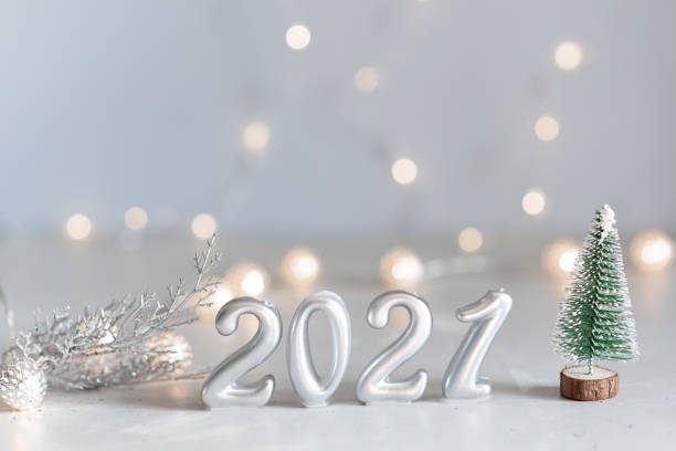 istock New Year 2021 silver balloons with fireworks 1218866655