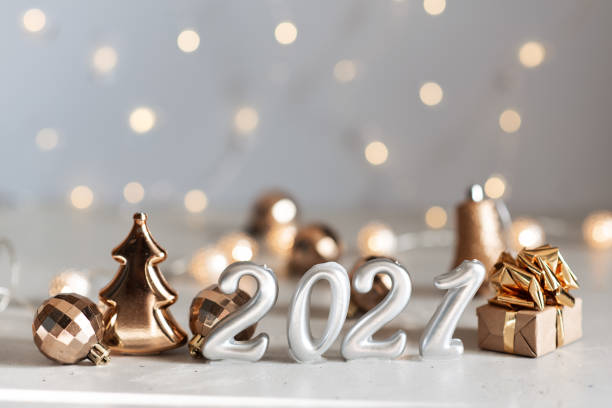 istock New Year 2021 silver balloons with fireworks 1218866663