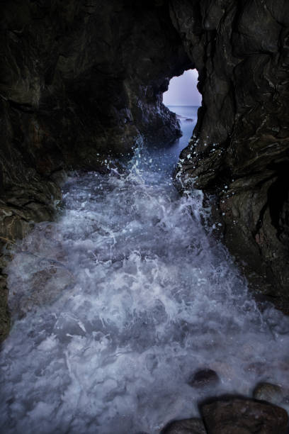 Pacific Waves Crash Through a Sea Cave at Leo Carillo State Park in Malibu, CA, United States