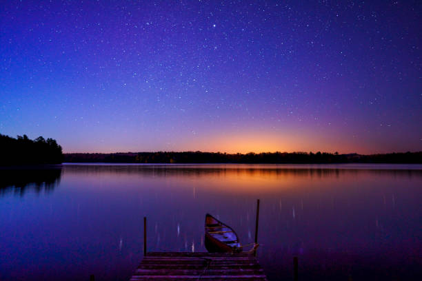 istock Red Canoe and Dock on a Misty Morning 1218867967
