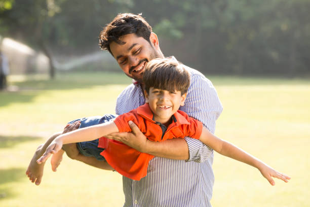 istock Father and son walking outdoors stock photo 1218868058