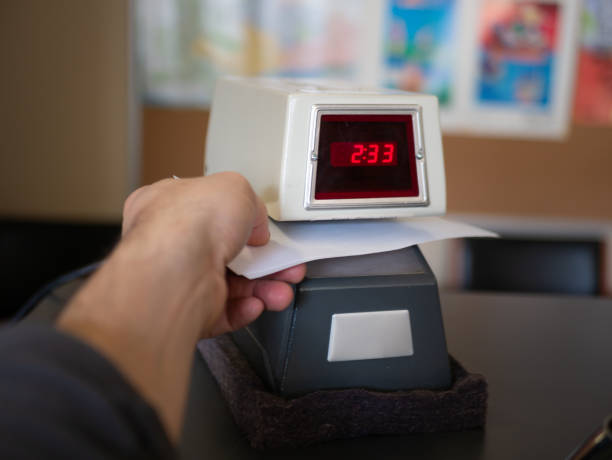 Electronic time recorder machine in an office. stock photo