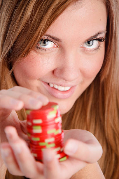 istock Young Woman Holding Poker Chips 121886899