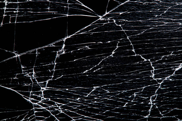 istock cracked glass isolated on a black background. 1218871041