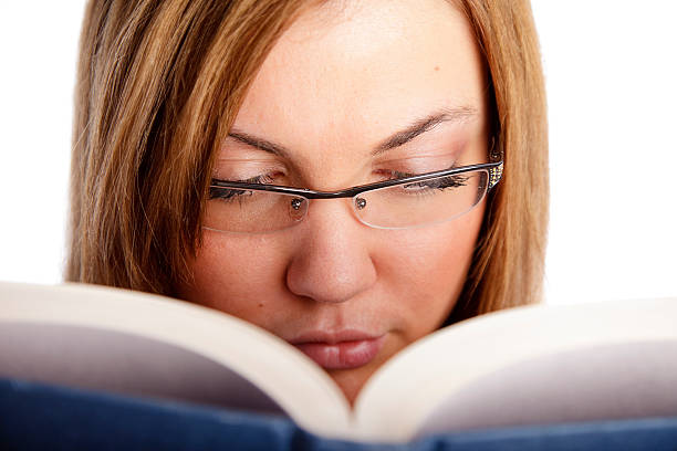 istock Young Woman Reading a Book 121887317