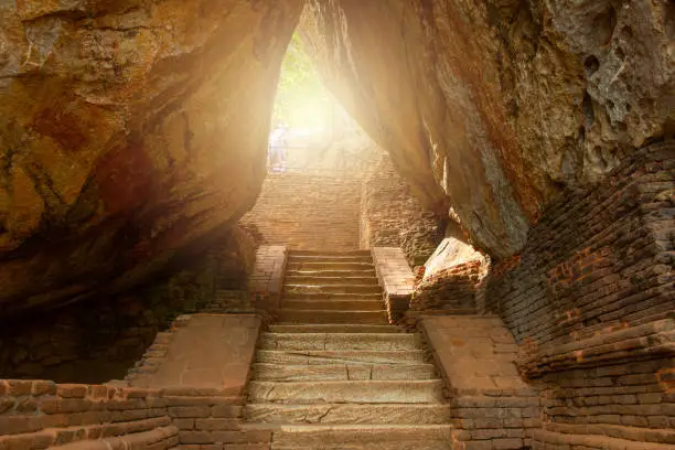 Photo of The narrow pathway to Sigiriya the UNESCO ancient fortress in Sri Lanka.