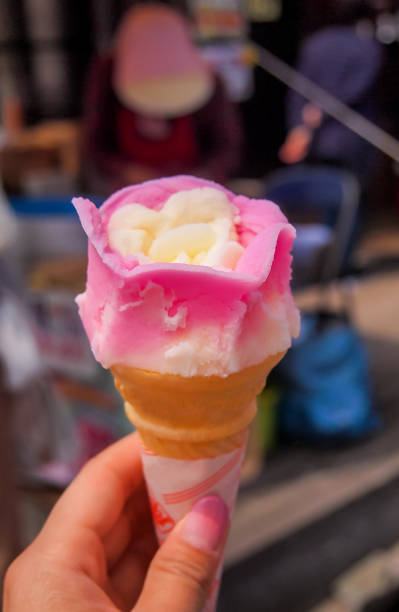 Kakunodate,Akita,Tohoku,Japan:Baba Hera Ice in rose petals shape with blurred background. Baba Hera ice is the very famous ice cream in Akita prefecture and sold at the street stalls.Baba means "old lady" and Hera means "spatula".Colorful ice in pink and yellow colors is very nice . japanese akita stock pictures, royalty-free photos & images