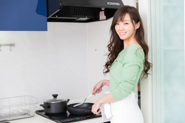 istock asian woman who cooks 1218878933