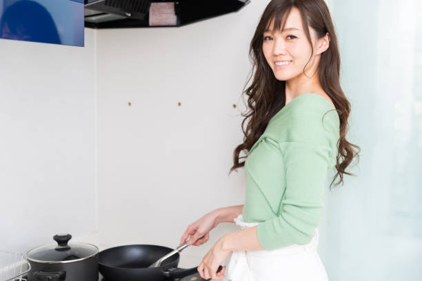 istock asian woman who cooks 1218879003