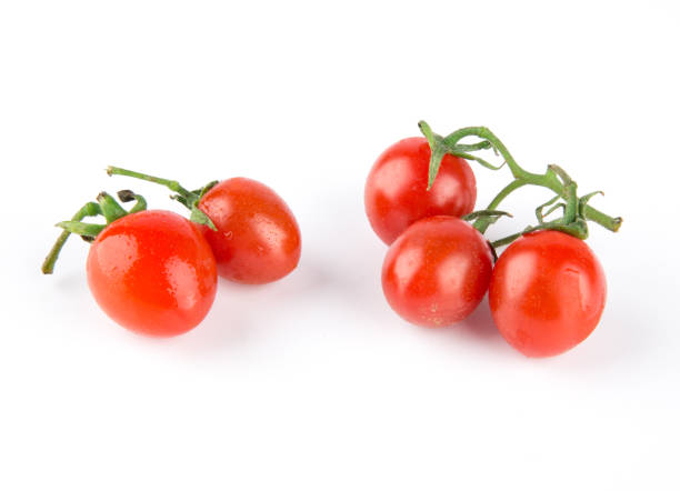 istock Fresh baby cherry tomatoes isolated on white background 1218879550