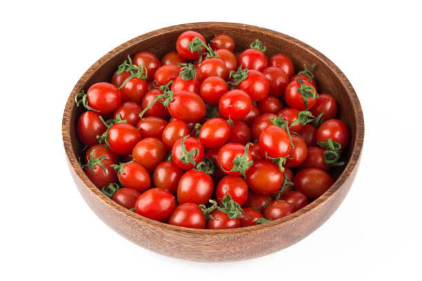 istock Fresh baby cherry tomatoes isolated on white background 1218879559