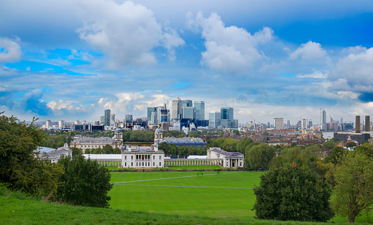 London, UK - September, 2018. View over Greenwich Park with Canary Wharf on the background. Landscape format.