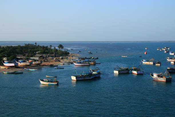 Dhanushkodi, India - October 06,2013: Fishermen in boats do fishing in Ramesawaram, Tamil Nadu, India. Rameswaram is the major fishing harbor in South India.