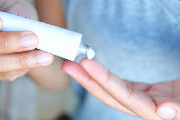 istock The woman's hand, she uses steroids Apply External type 1218887138