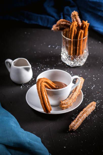 istock Churros with sugar and chocolate sauce 1218888055