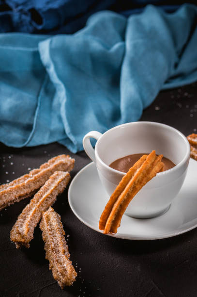 istock Churros with sugar and chocolate sauce 1218888056