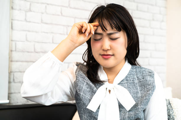 istock Young woman suffering from headache 1218891185