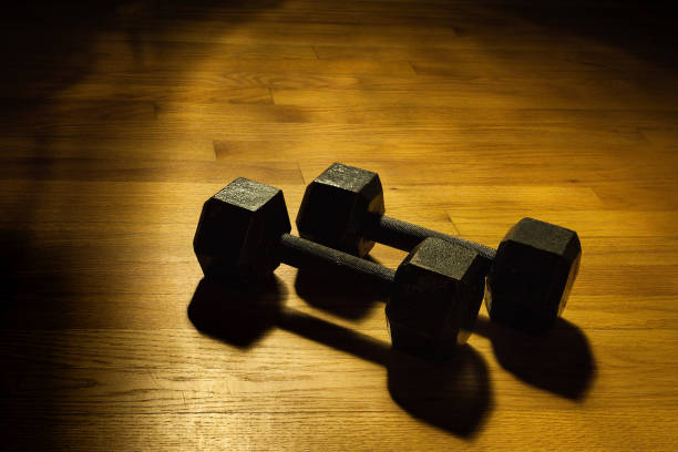 istock Dumbbells on a gym floor 1218892726