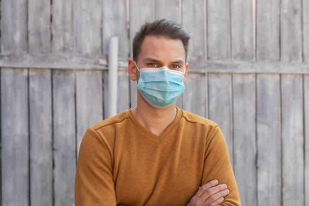 istock Young man with surgical mask 1218893550