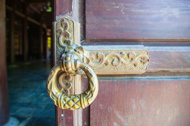 ld wooden gate closed on a large barn castle. The old and mysterious wooden gate is closed to a large wooden castle ld wooden gate closed on a large barn castle. The old and mysterious wooden gate is closed to a large wooden castle fairy door fairy tale antique stock pictures, royalty-free photos & images