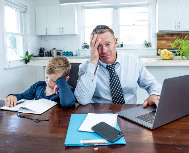 COVID-19 Working from home. Stressed parent trying to cope with remote work and homeschooling. Coronavirus pandemic forces shutdowns, quarantine, online learning and Work.
