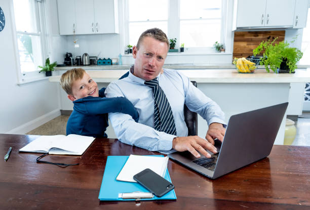 istock COVID-19 Working from home. Stressed parent trying to cope with remote work and homeschooling. Coronavirus pandemic forces shutdowns, quarantine, online learning and Work. 1218898914