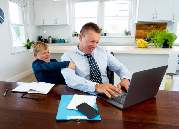 istock COVID-19 Working from home. Stressed parent trying to cope with remote work and homeschooling. Coronavirus pandemic forces shutdowns, quarantine, online learning and Work. 1218899005