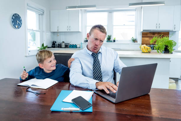 istock COVID-19 Working from home. Stressed parent trying to cope with remote work and homeschooling. Coronavirus pandemic forces shutdowns, quarantine, online learning and Work. 1218899012